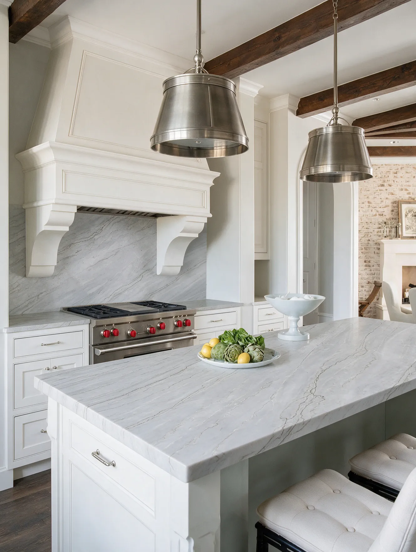 Kitchen with a quartzite island and full-height backsplash