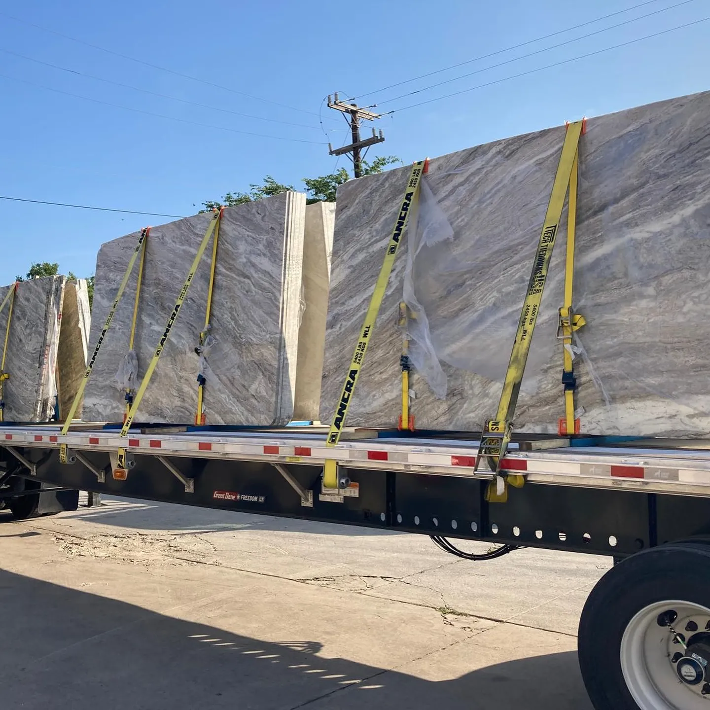 Quartzite slabs strapped on a flatbed for delivery